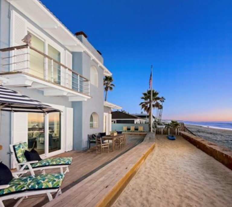 Beautiful white and blue house on the beach.